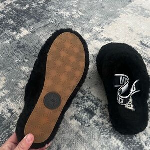 UGG Black Fluffy Slippers with Tan Sole